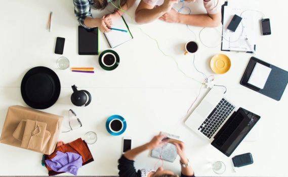 Normal_normal_stock-footage-mixed-race-group-of-people-aerial-view-timelapse-hipster-office-small-business-start-up-company1